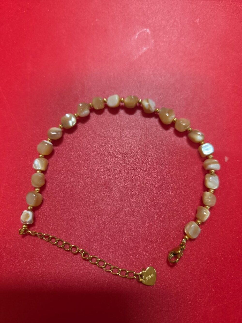 natural color shell  beaded bracelet in goldtone  6.6 to 7 very delicate